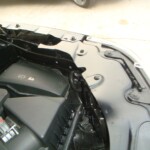 Before and after photographs of a damaged, black, Range Rover that was repaired by Elite Paint & Body Shop in West Palm Beach, FL.
